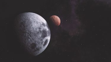 An illustration showing a planet and moon