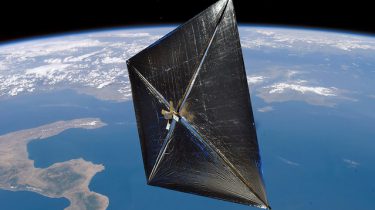 A solar sail deployed in orbit of the Earth